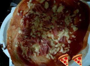 Una foto de Pizza al comal