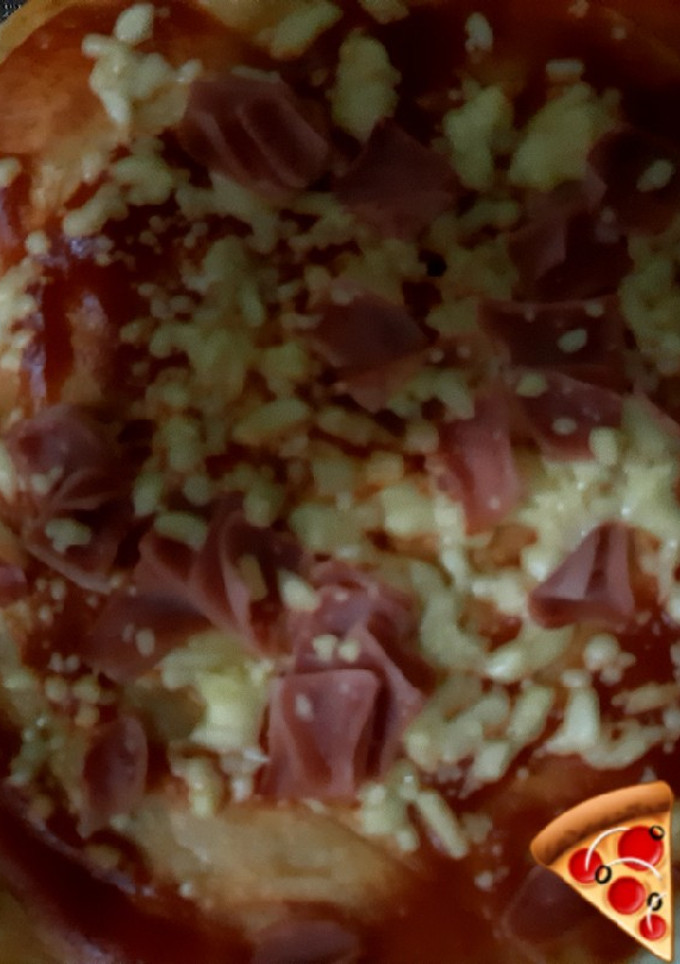 Una foto de Pizza al comal