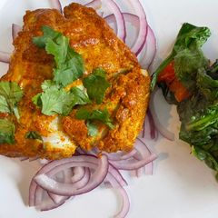 A picture of Tandoori Cod with Wilted Spinach.