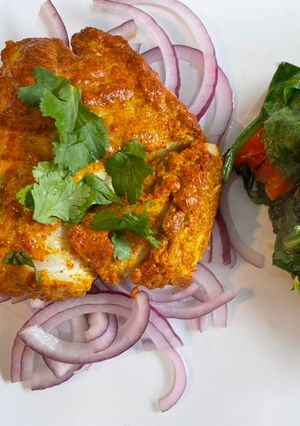 A picture of Tandoori Cod with Wilted Spinach.