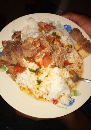 A picture of Beef stew with rice.