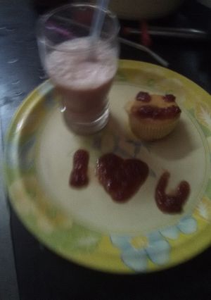 A picture of Strawberry shake with vanilla ice - cream.