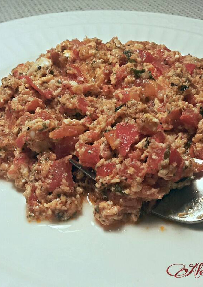 Una foto de Revuelto de tomates peras