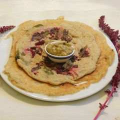 A picture of A Healthy Adai Dosai with Quinoa with red amaranth leaves.