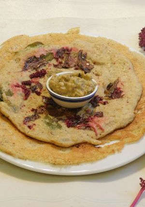 A picture of A Healthy Adai Dosai with Quinoa with red amaranth leaves.