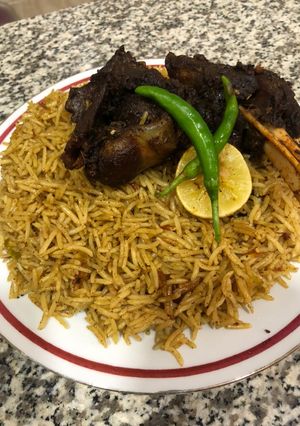 A picture of Mandi lamb and rice.