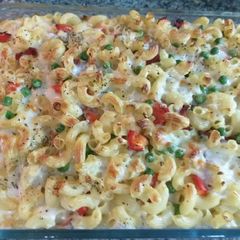 A picture of Mac and cheese with smoked beef and veggies.