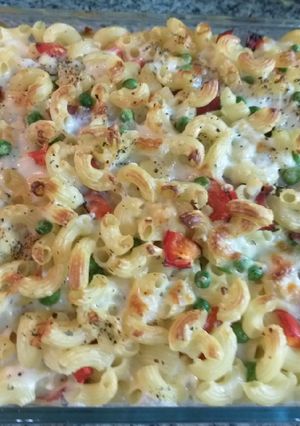 A picture of Mac and cheese with smoked beef and veggies.