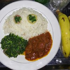 A picture of Rice,stew and vegetable.