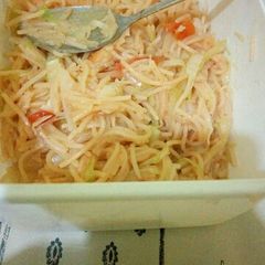 A picture of Fried suppergetti,rice and buttered cabbage.