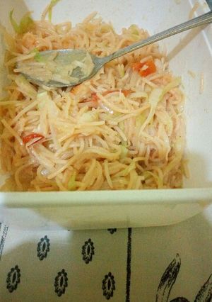 A picture of Fried suppergetti,rice and buttered cabbage.