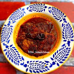 A picture of Lonka Pora Rui(Fish Curry in Roasted Chilli Sauce).