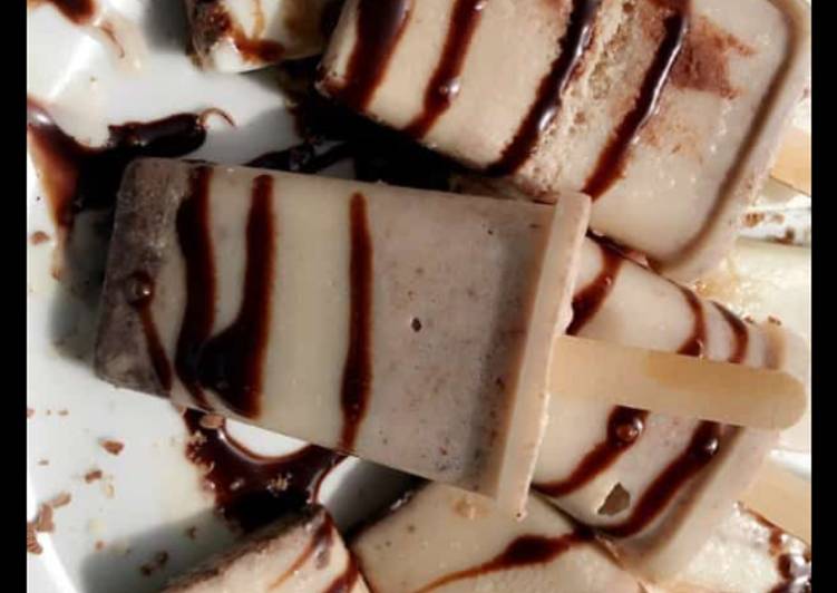 Homemade vanilla ice pop glazed with chocolate syrup