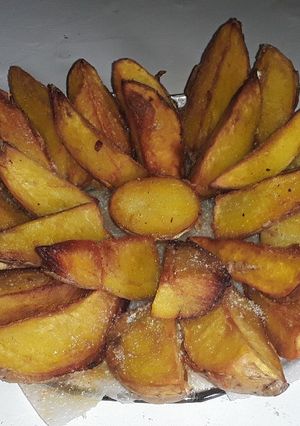 Una foto de Papas en gajos