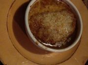 A picture of french onion soup with beef