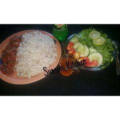 A picture of Rice&beans serve with lettuce.