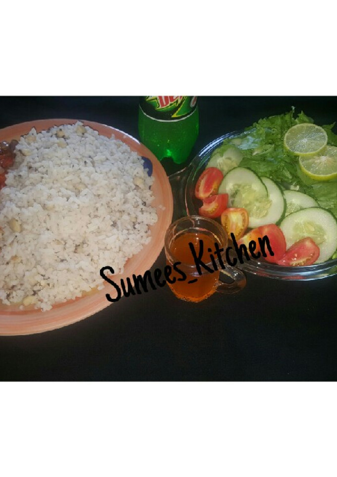 A picture of Rice&beans serve with lettuce.