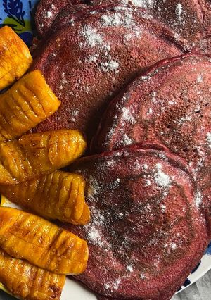 A picture of Red velvet pancakes w/ fried plantains 😃.