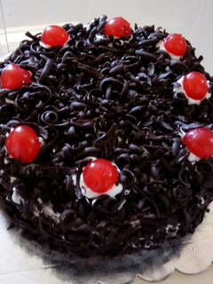 A picture of Black Forest Cake with The Cake Girl.