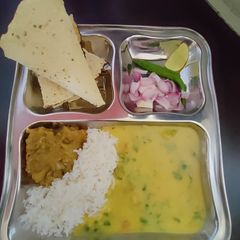 A picture of Ghar ki thali Dal chawal baingan ka bharta.