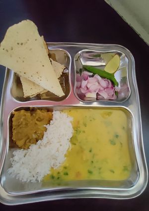 A picture of Ghar ki thali Dal chawal baingan ka bharta.