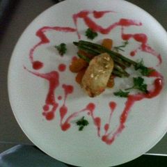 A picture of Chicken kiev with cherry sauce.