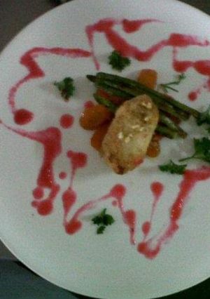 A picture of Chicken kiev with cherry sauce.