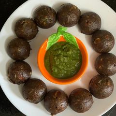 A picture of Ragi Paniyaram Loaded With Veggies.