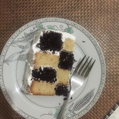 A picture of Vanilla chocolate mint checker board cake.