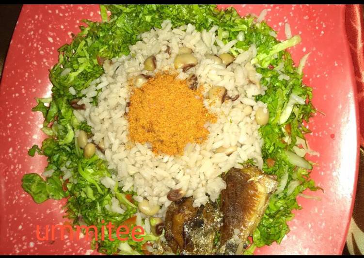 Rice and beans with salad and fried fish