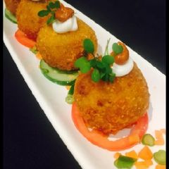 A picture of Cheesy Arancini.