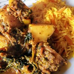 A picture of Saag aloo, with spring greens.