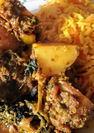 A picture of Saag aloo, with spring greens.