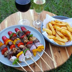 A picture of Beef and Vegetables Kebab with Frenchfries.