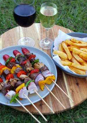 A picture of Beef and Vegetables Kebab with Frenchfries.