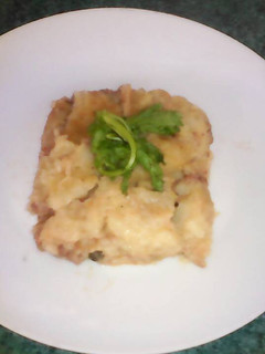 Una foto de Capeado de papa relleno de carne, vegetales y queso mix