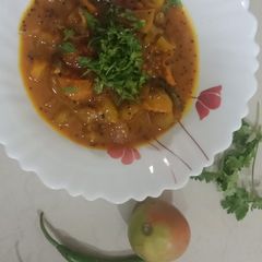 A picture of Spicy and tangy raw tomato curry.