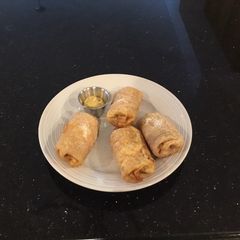 A picture of Ham and cheese spicy egg rolls.