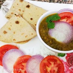 A picture of Green gram with low spices and  whole wheat flour chapati.
