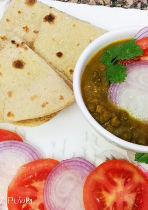 A picture of Green gram with low spices and whole wheat flour chapati.