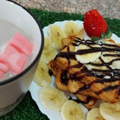 A picture of French Toast with fresh fruits.