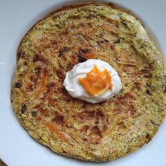 A picture of Omelette with onion and carrot.