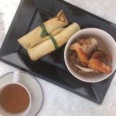 A picture of Pancake roll with fish pepper soup.