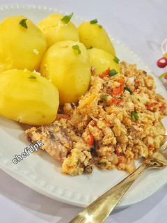 A picture of Boiled Irish potatoes with egg sauce.