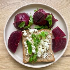 A picture of Whole Grain Toast with Goat Cheese, Beetroot & Fresh Mint.