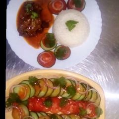 A picture of Beef stew served with braised rice.