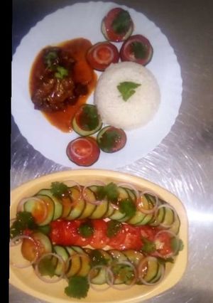 A picture of Beef stew served with braised rice.
