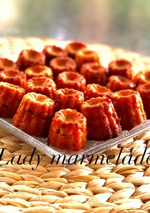 A picture of Savory Canelés with Chorizo and Sun-Dried Tomatoes in Olive Oil.