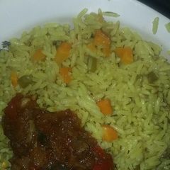 A picture of Soyayyar shinkafa(fried rice) & beef sauce.