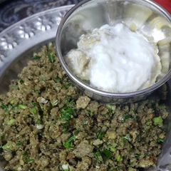 A picture of Harra lehsan with bajra roti and baingun bhurta.